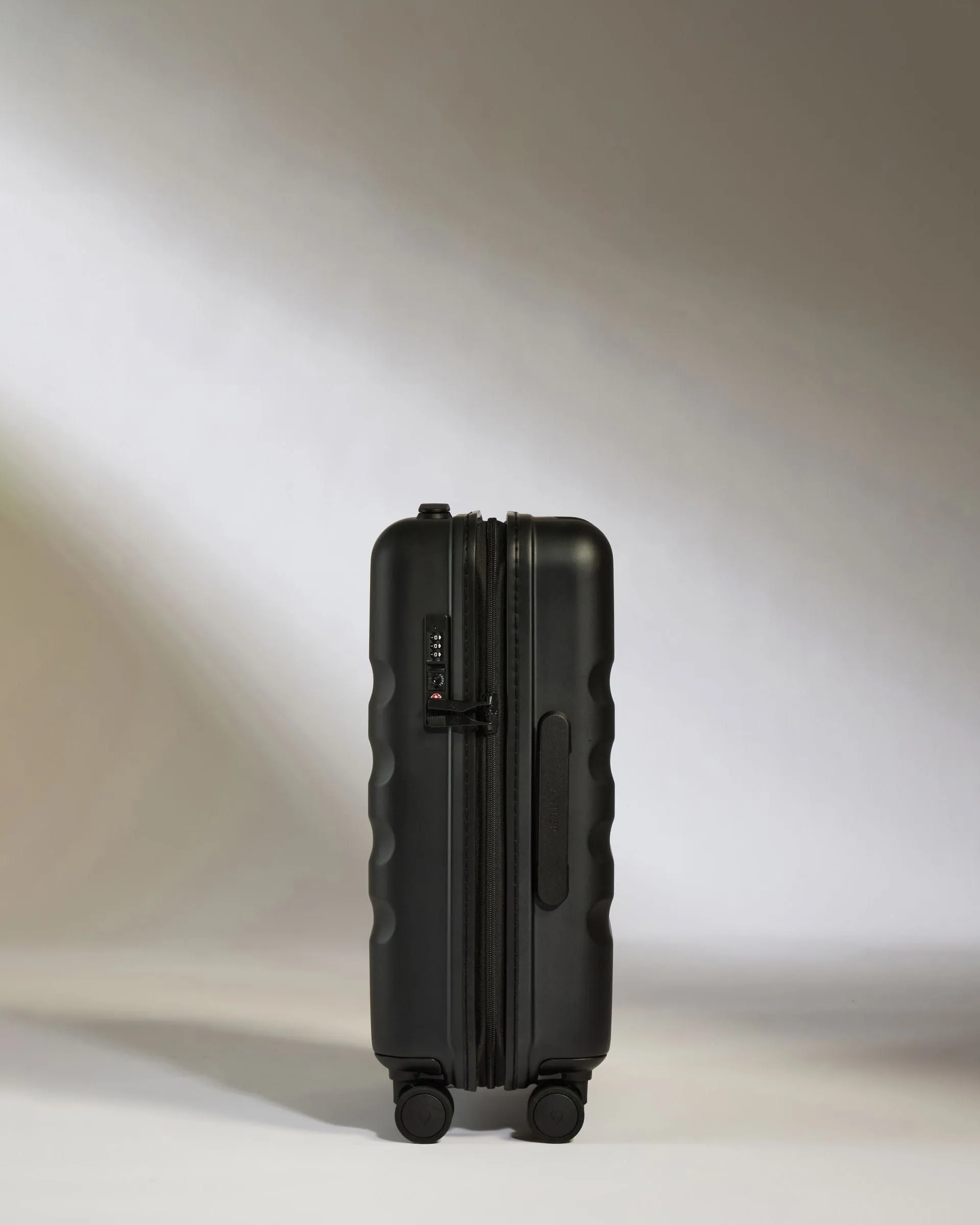 Cabin Suitcase in Black - Icon Stripe